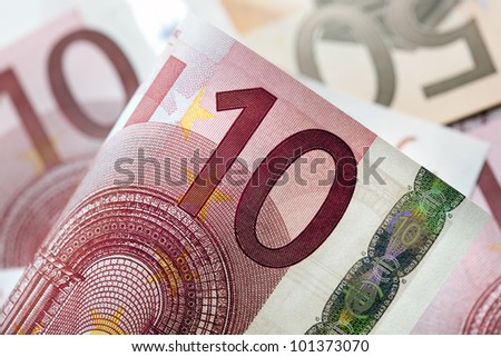 Euro notes in full-frame, with focus on front ten Euro note.