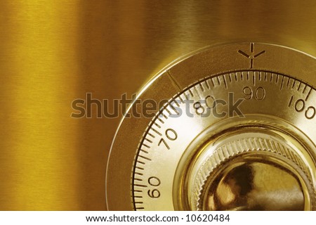 Golden safe lock, in close-up.