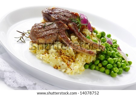 Grilled lamb cutlets on a bed of mashed potato with seeded mustard, fresh sugar snap peas, and grilled red onion.  Garnished with rosemary.