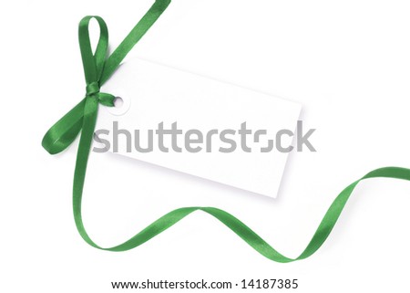 Blank gift tag tied with a bow of green satin ribbon.  Isolated on white, with soft shadow.