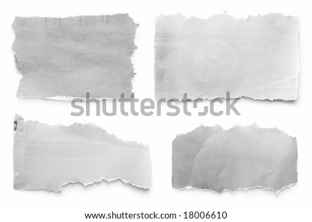 Newspaper tears collection, casting natural shadow on white.