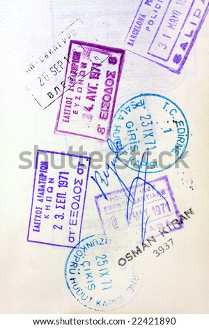 Old visa stamps on a passport page.  Includes stamps from Spain, Turkey, Bulgaria and Greece.