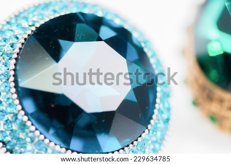 beautiful ring with blue gem (stone) isolated on white background