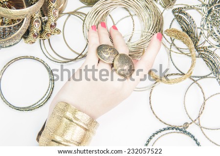 Beautiful rings and bangles on hand.Expensive Gold Jewelry background