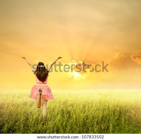 Happy woman jump and sunset
