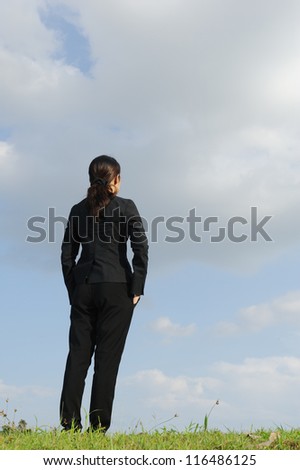 Smart business woman plan for success and blue sky