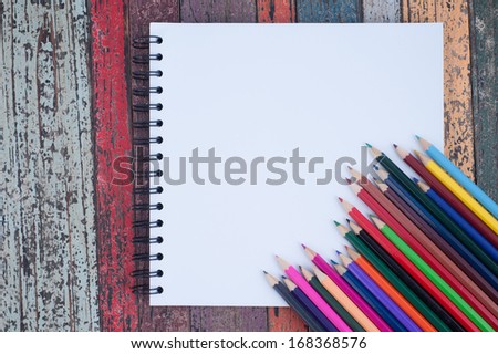 Color pencil  on sketch book and   vintage wood table for background and text