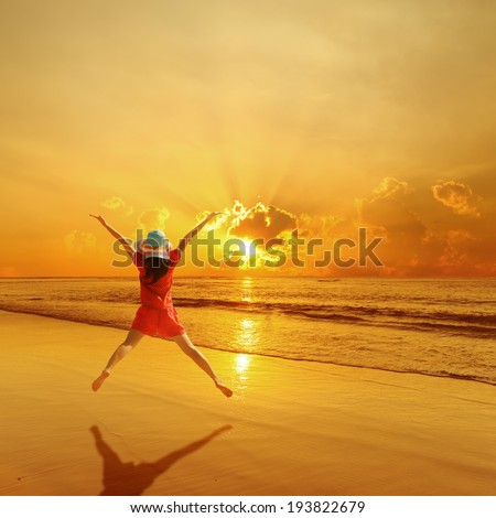 Happy Woman  Jumping on Beach Sunset