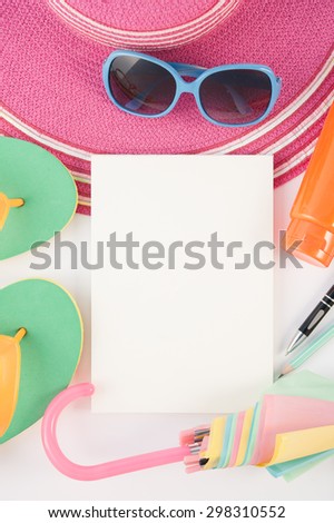 Straw hat sunglasses  and notebook on white background.Summer holiday background concept.Copy space.