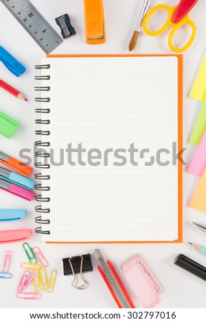 Open blank Notebook and school or office tools  on white background And