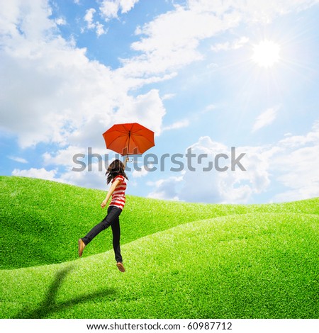 Red umbrella woman in grassland and sun sky