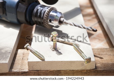 electric drilling and skcrew nut on working object use for diy tool and home maintenance
