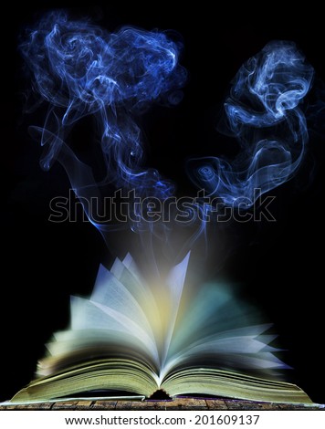 abstract of  open book page with moving smoke on black background use for education and idea creative object