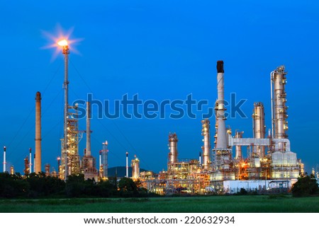 beautiful lighting of oil refinery palnt against dusky blue sky of oil refinery plant in heavy petrochemical industry estate