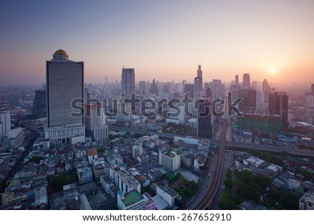 beautiful city scape urban scene  of bangkok capital of thailand in morning light glow up view from peak of sky scrapper building