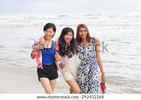 portrait of young beautiful asian woman friend relaxing happy emotion on sea beach vacation holiday