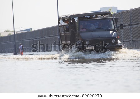 BANGKOK THAILAND - OCT 27 : thai military truck navigated through the flood water on october 27,2011 in Bangkok Thailand