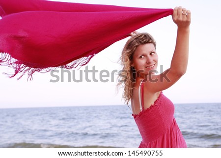 pregnant woman on the beach with a handkerchief