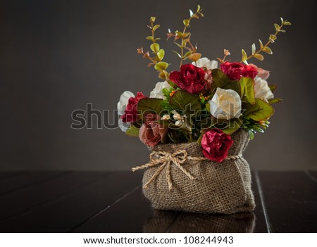 still life with rose flower on wall background