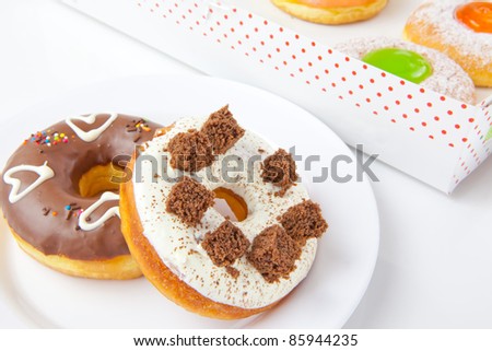 donuts on plate and Box full of donuts set