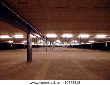an empty spacious parking lot with leading line