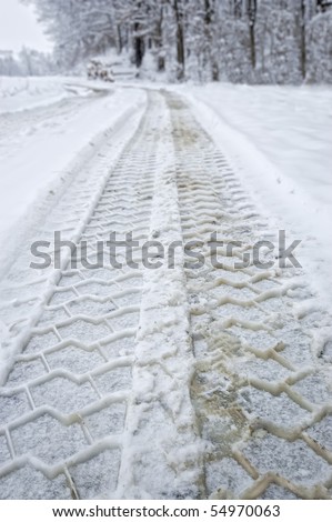 Winter road: vehicle tracks.