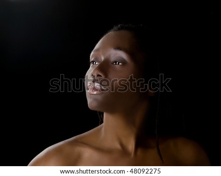 Pretty black woman portrait against dark background