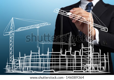 business man drawing construction site