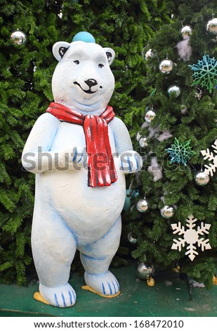 white teddy bear with decorations under the Christmas tree