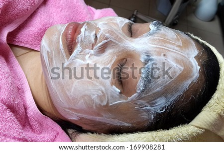 asian woman with facial mask at a beauty salon