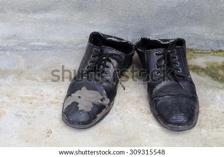 Dirty old shoes on floor