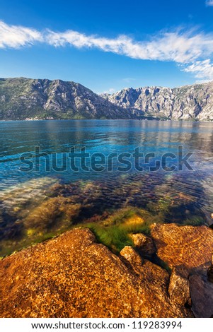 Stones beach with sea and mountain views.  Montenegro