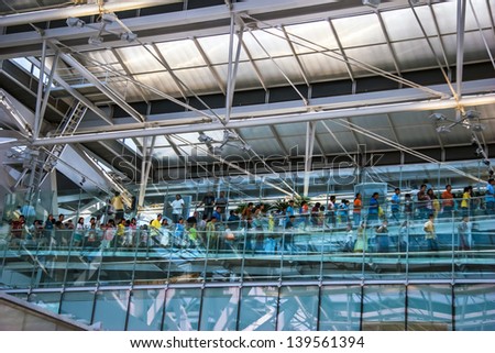 BANGKOK - OCTOBER 15: The human moves on the escalator at Suvarnabhumi International Airport on October 15, 2006 in Bangkok. The airport is 18th busiest in the world (by passenger traffic).
