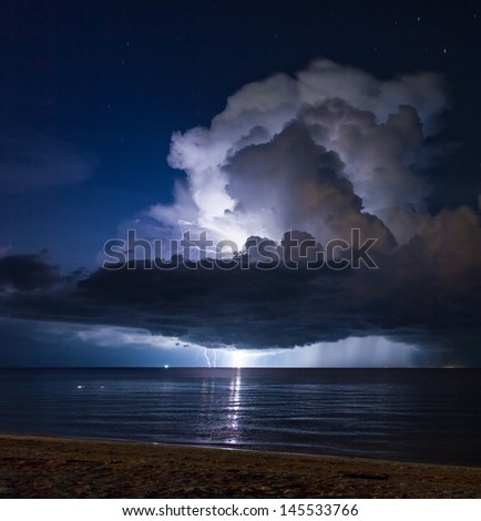 Lightning above the sea in tropical night at the beach.Thailand