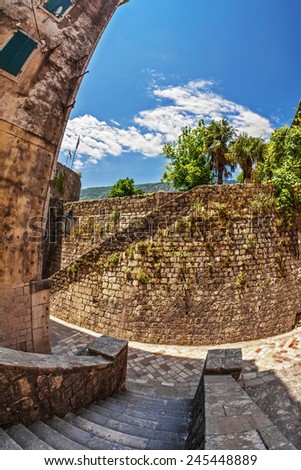 Fish-eye lens look of the old city on sky background. Kotor. Montenegro