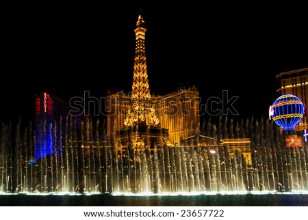 LAS VEGAS, MAY 2, 2007: Dancing musical fountains of the Bellagio Hotel on Flamingo Casino background, May 2, 2007. The fountain has 1175 jets of water 80 meters high, 4500 lamps of light at a cost of $40 million to build.