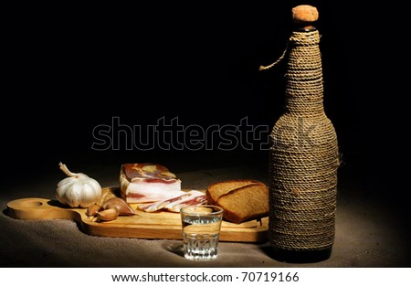 Still-life with bacon, bread and vodka