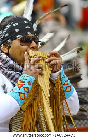 HELSINKI, FINLAND - MAY 1: Native American Indian tribal group play music and sing in the street for tourists and city dwellers on May 1, 2011 in Helsinki, Finland
