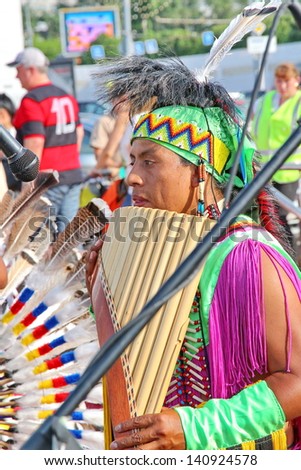 MOSCOW, RUSSIA - JUNE 1: Native American Indian tribal group play music and sing in the street for tourists and city dwellers on June 1, 2013 in Moscow, Russia