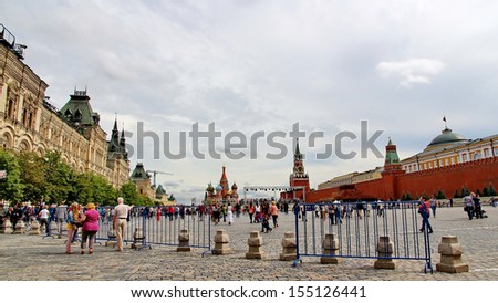 MOSCOW - JULY 20: Tourists visiting the Red Square on july 20, 2013 in Moscow, Russia. The Red Square and the Kremlin are the main attractions in Moscow