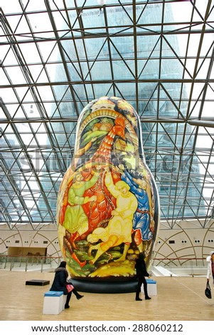 MOSCOW - JANUARY 4: Afimall on January 4, 2013 in Moscow, Russia. Exhibition of the giant Russian dolls - Matryoshka - in height from 6 to 13 meters in Shopping complex Afimall City.
