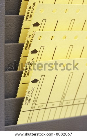 job time cards in rack at place of employment