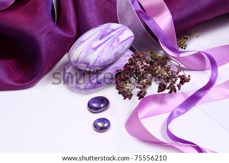 Violet aromatic soap with herbs and purple decorative fabric