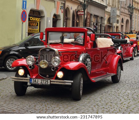 Prague, Czech Republic - November 9, 2014: Red Ford retro car waiting for the next customer to entertain. These cars are usually rented by the tourists visiting Prague.