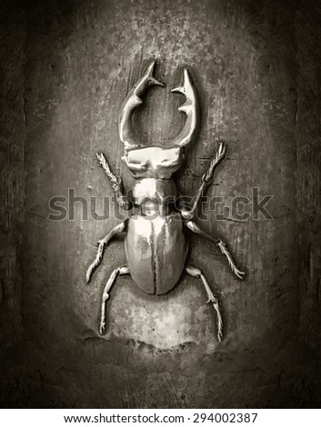 The stag beetle - Lucanus cervus made of metal, black and white image