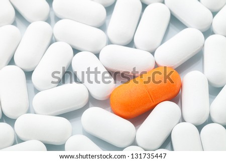Antibiotic treatment: Single orange pill between white ones