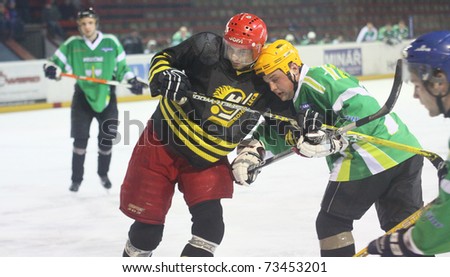 ZDAR, CZECH REP-MAR 12: Ales Chrast from Bohdalec (red helmet) in ice hockey match of Regional ice hockey league Between Bohdalec and Pisecne. March 12, 2011 in Zdar. Final score 3:2