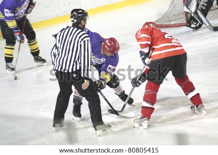 OLESNA, CZECH REP-SEPT. 26: Jan Jun from Olesna (purple) competes in ice hockey match of Regional ice hockey league Between Olesna and Lisek on September 26, 2010 in Olesna. Final score 3:2