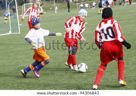 JAMY, CZECH REP - SEPTEMBER 30: Petr Toufar (red centered) from Bystrice competes in a match Bystrice vs Trebic at Czech child league on September 30, 2011 in Jamy, Czech Republic. Final score 6:7
