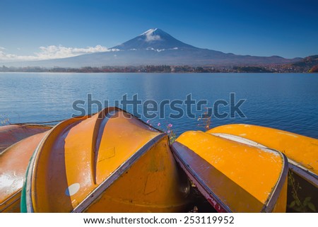 Mountain Fuji with Yellow row boats sink on lake in the morning in Kawaguchiko, Japan